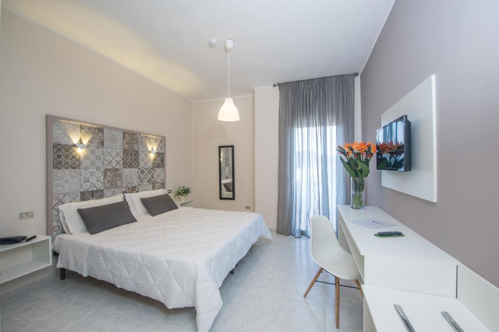 Postel nebo postele na pokoji v ubytování Hotel Club Eloro
