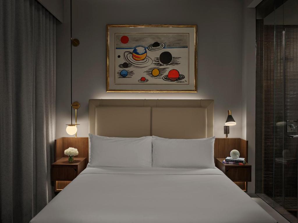 Cama ou camas em um quarto em ModernHaus SoHo