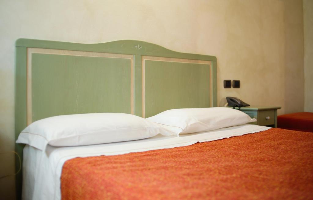 Posteľ alebo postele v izbe v ubytovaní Due Ponti Village