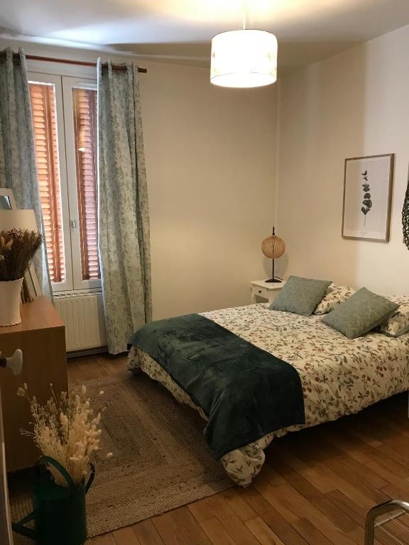 Postel nebo postele na pokoji v ubytování La Suite