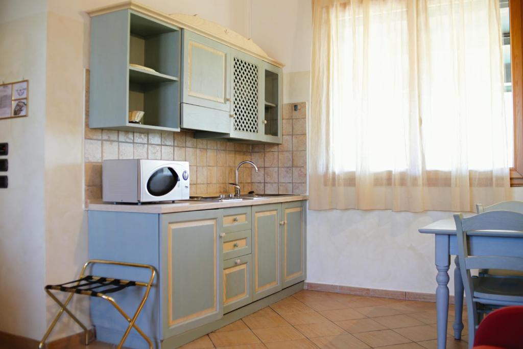 Kuchyňa alebo kuchynka v ubytovaní Due Ponti Village