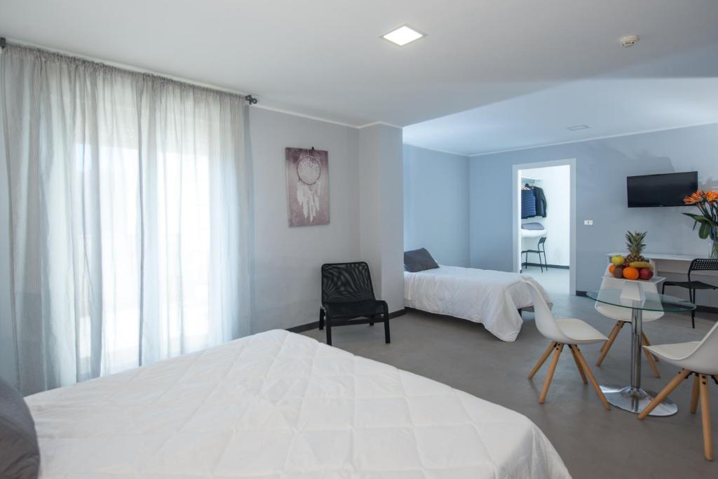 Postel nebo postele na pokoji v ubytování Hotel Club Eloro