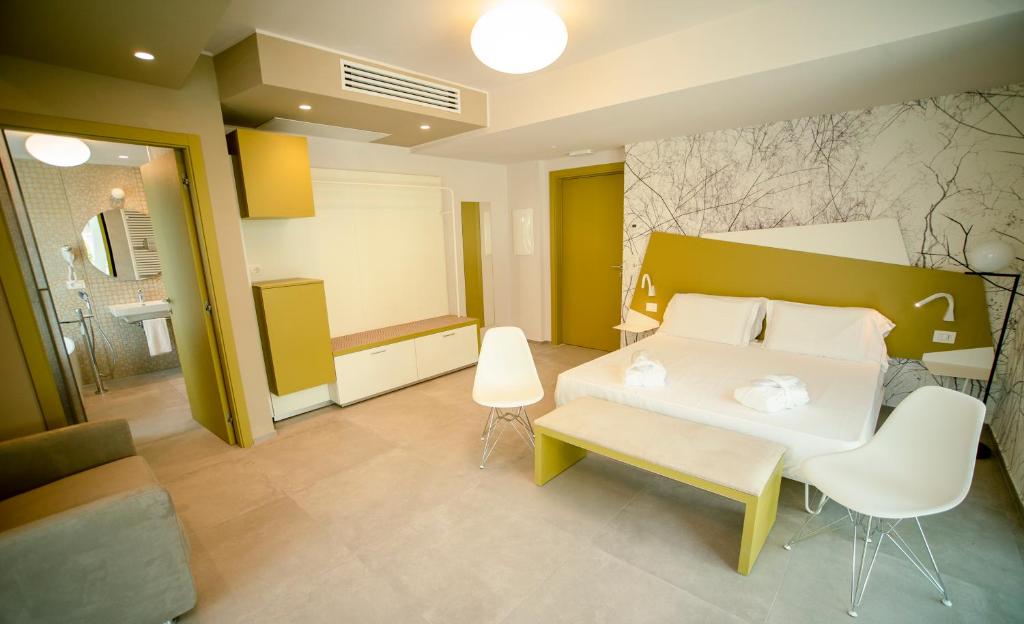 Posteľ alebo postele v izbe v ubytovaní Hotel Malavoglia