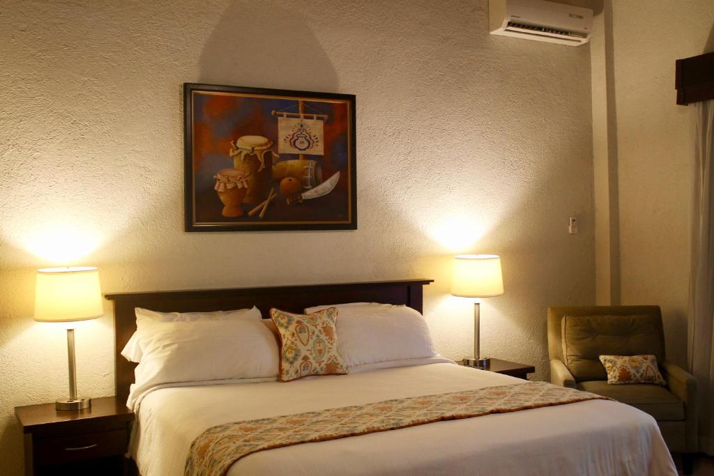 Postel nebo postele na pokoji v ubytování Hotel Villa Therese