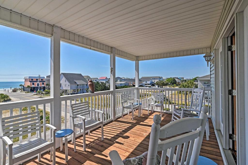 a porch with chairs and a view of the ocean at Murrells Inlet Home with 3 Decks - 1 Block to Beach! in Myrtle Beach