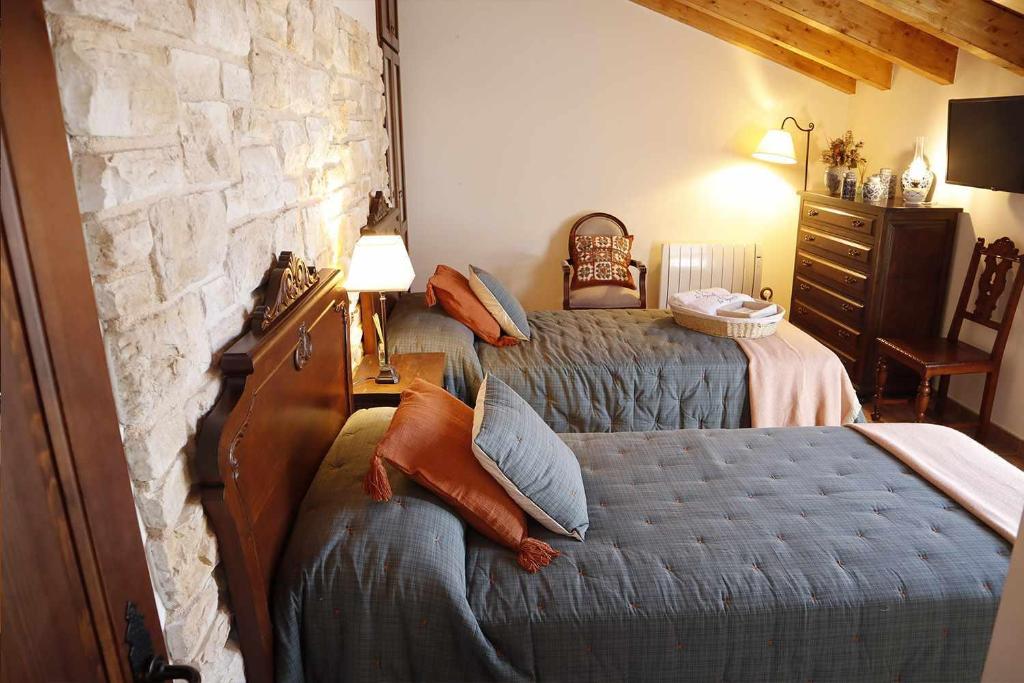 Postel nebo postele na pokoji v ubytování Casa Rural La Tayuela
