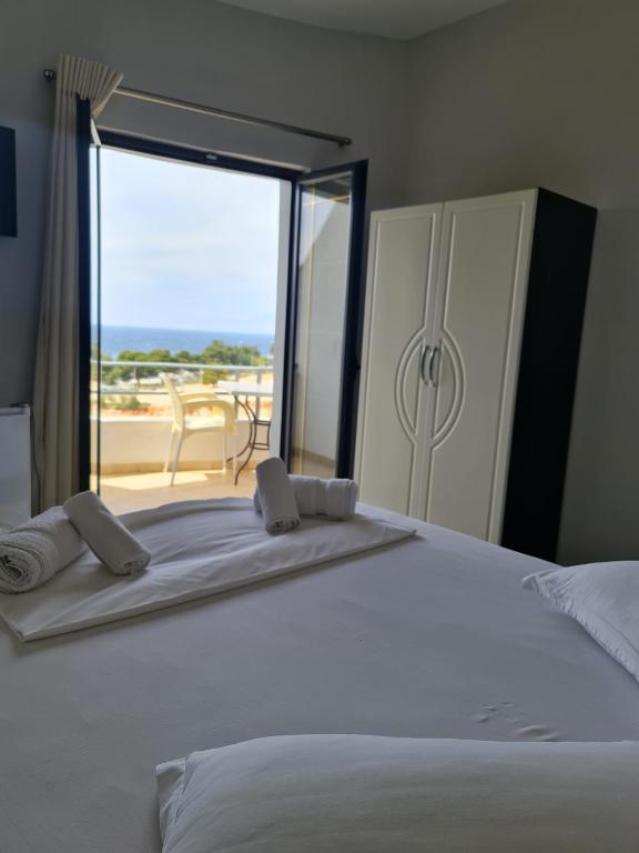 Postel nebo postele na pokoji v ubytování Hotel Ardiani