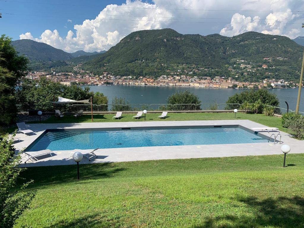 a swimming pool with a view of a body of water at Villa Barbara in Salò