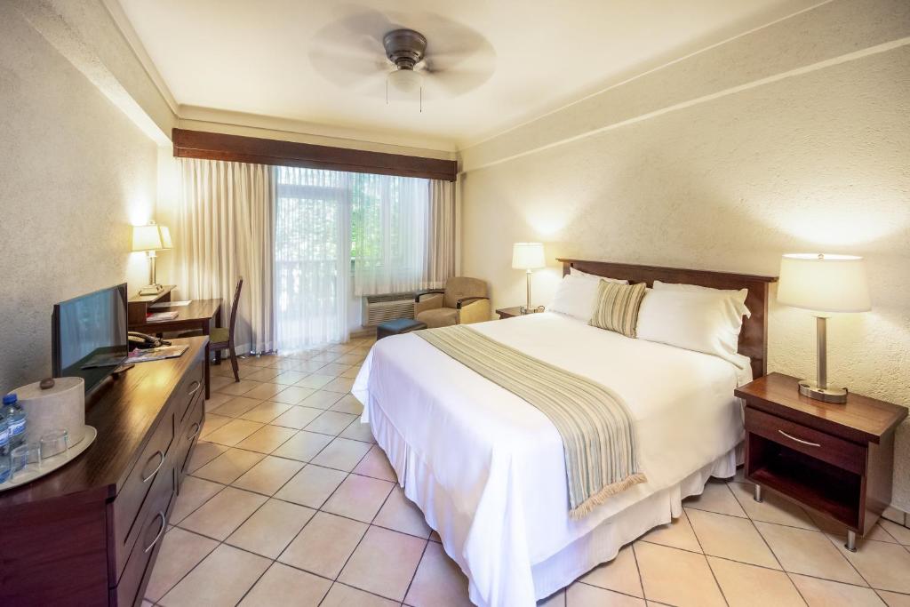 Postel nebo postele na pokoji v ubytování Hotel Villa Therese