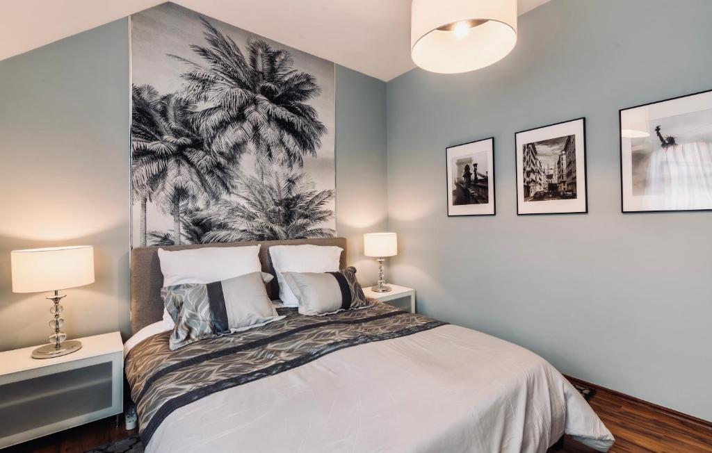 Posteľ alebo postele v izbe v ubytovaní Monarchia Apartman Grand