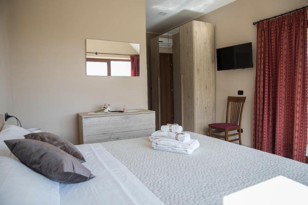 A bed or beds in a room at Divino Bistrot e Relais