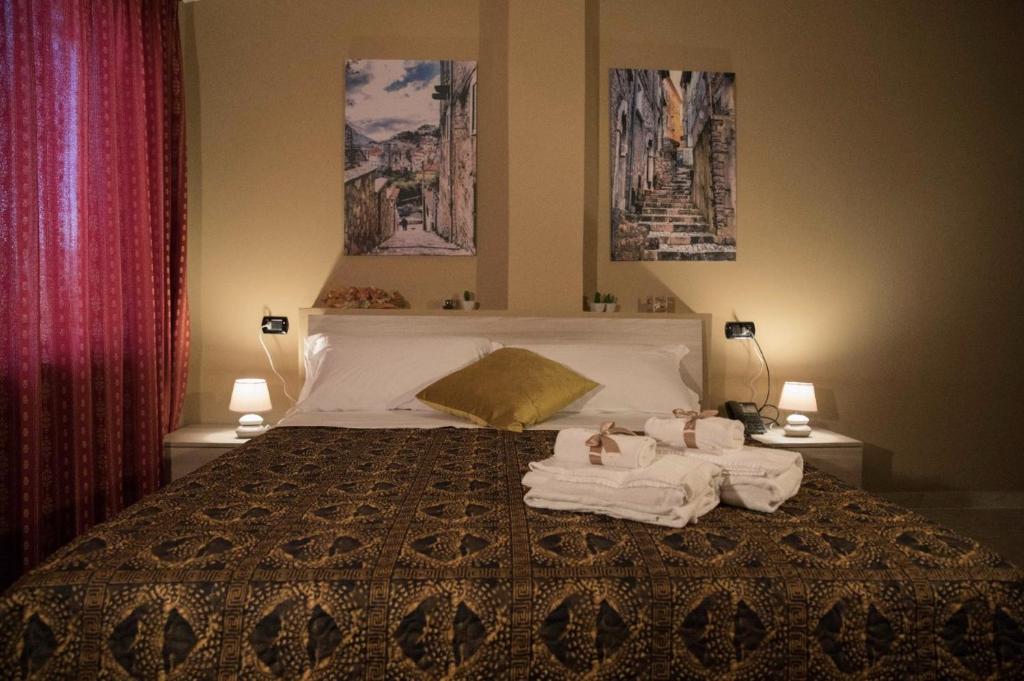 A bed or beds in a room at Divino Bistrot e Relais