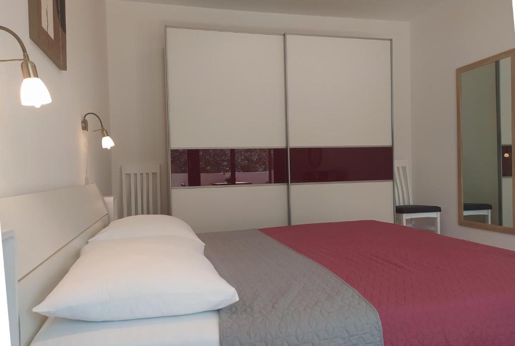 Posteľ alebo postele v izbe v ubytovaní Apartament Oliva