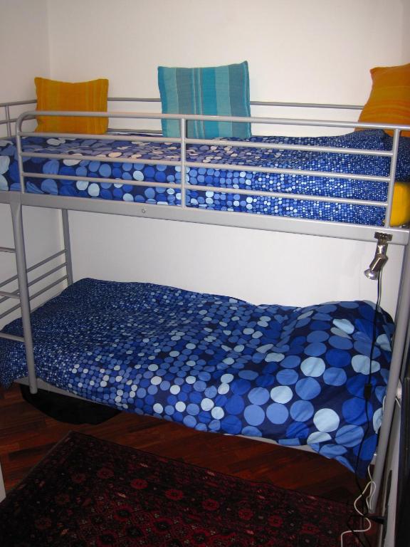 A bed or beds in a room at Mondello Luxury Apartment on the Beach