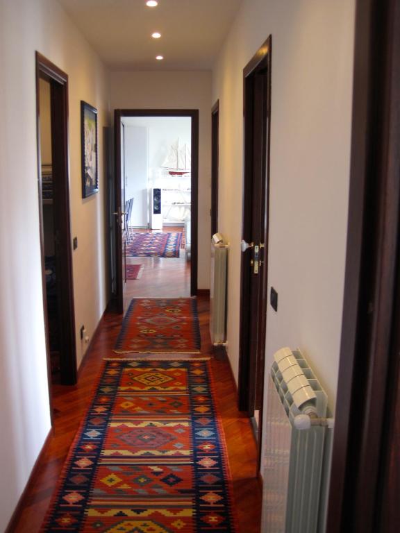 A bed or beds in a room at Mondello Luxury Apartment on the Beach