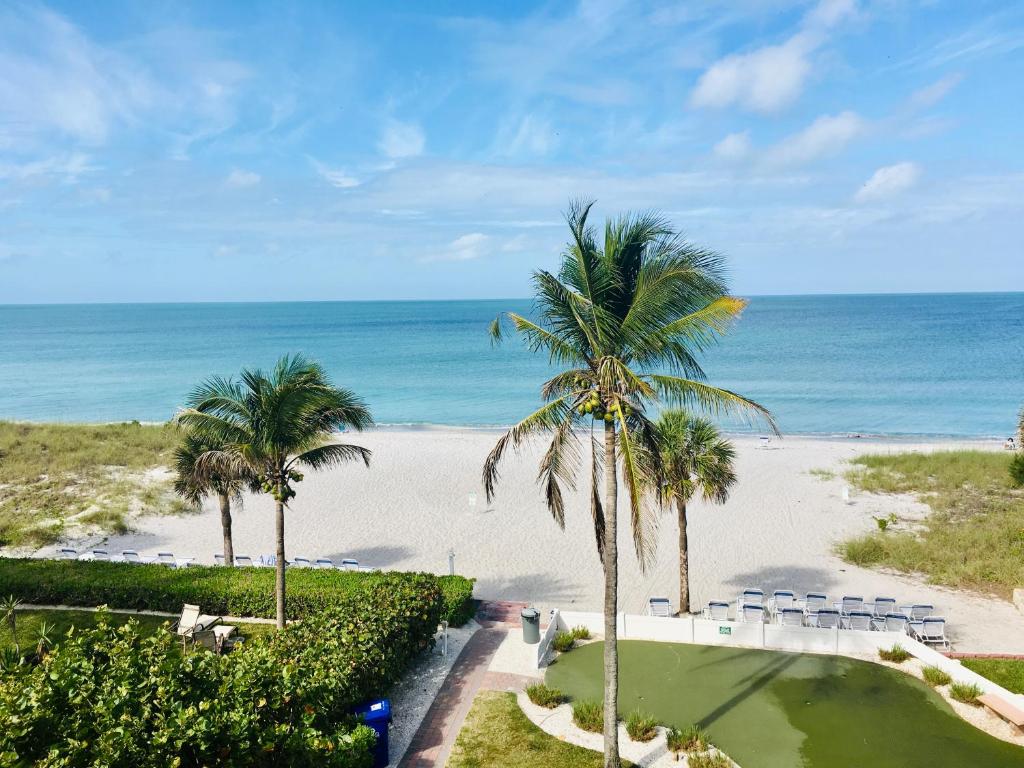 a view of the beach from the balcony of a resort at Amazing Panoramic Beach View and The Most Beautiful Sunset in Longboat Key