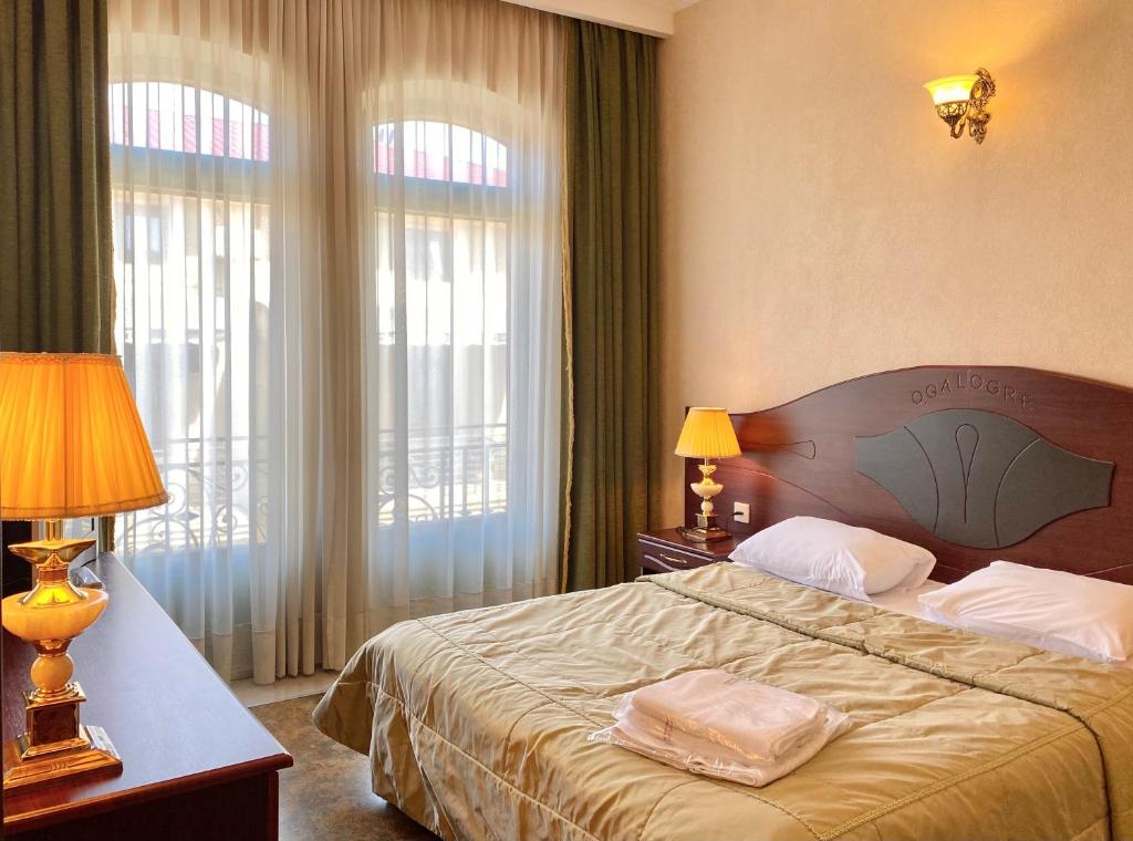 Rúm í herbergi á Boutique Hotel O. Galogre