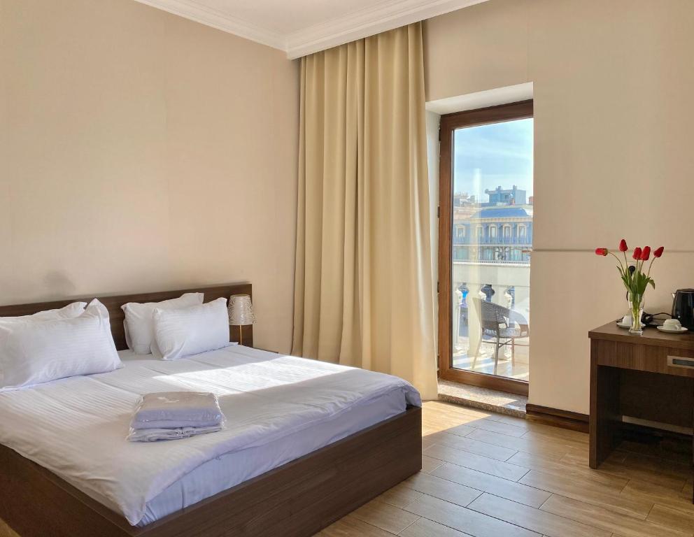 Rúm í herbergi á Boutique Hotel O. Galogre