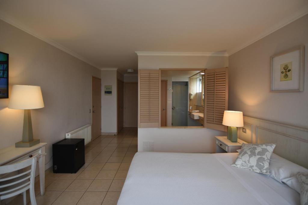 Postel nebo postele na pokoji v ubytování Hippocampus Resort & Spa