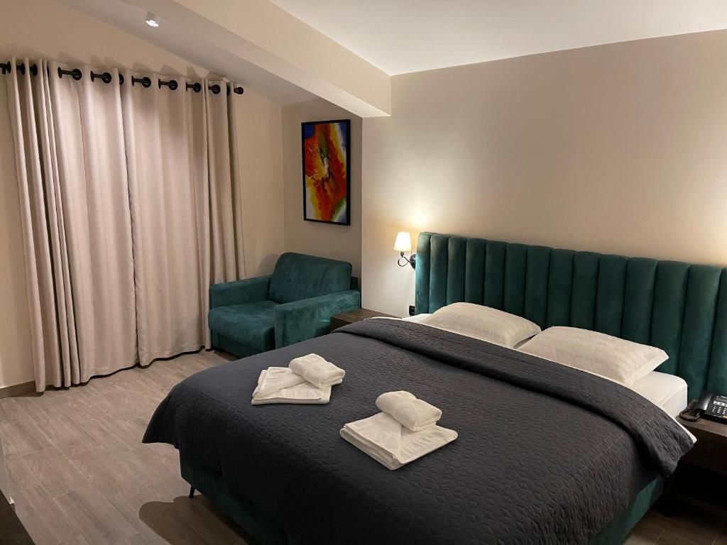 Postel nebo postele na pokoji v ubytování Venis Hotel