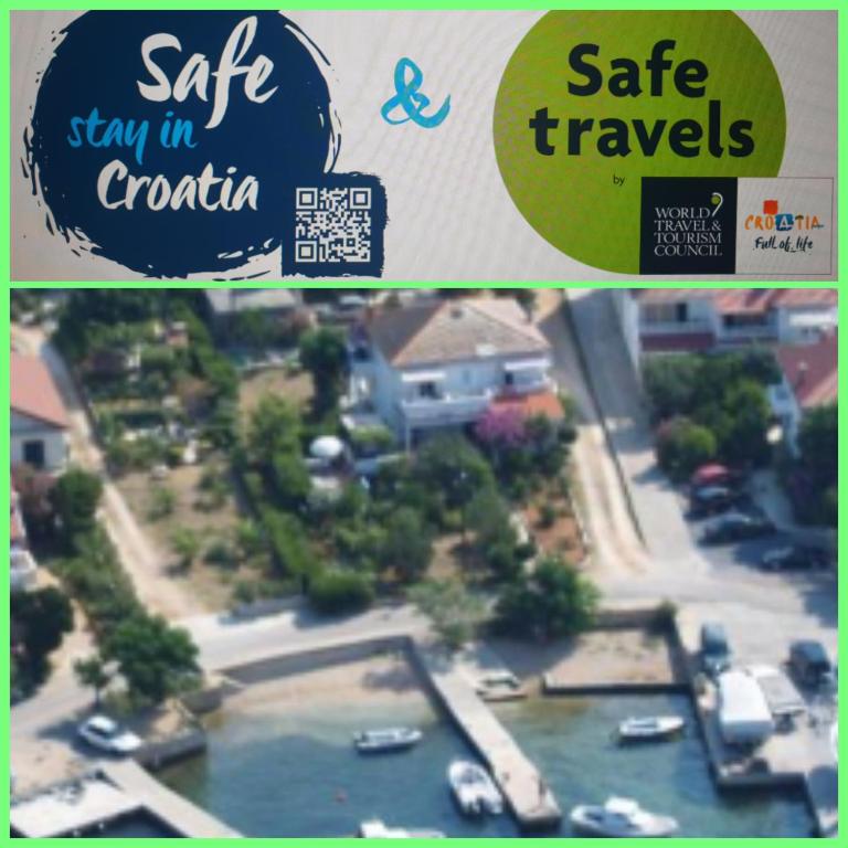 a flyer for a sale of a model of a marina at Bed and breakfast Nika in Rab