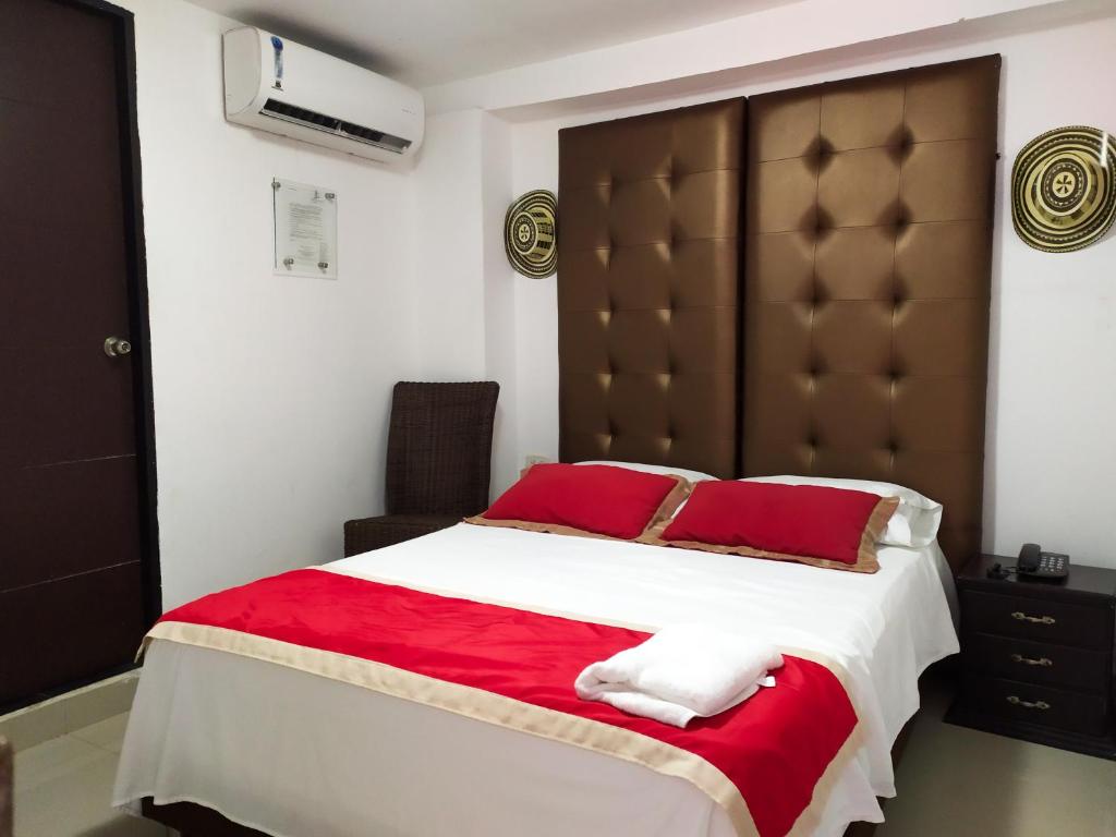 Postel nebo postele na pokoji v ubytování Hotel Plaza Colonial