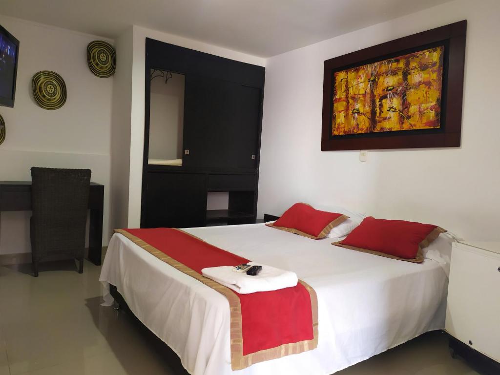 Postel nebo postele na pokoji v ubytování Hotel Plaza Colonial