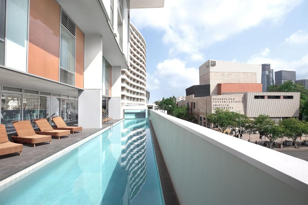 a swimming pool on the roof of a building at Mantra South Bank Brisbane in Brisbane