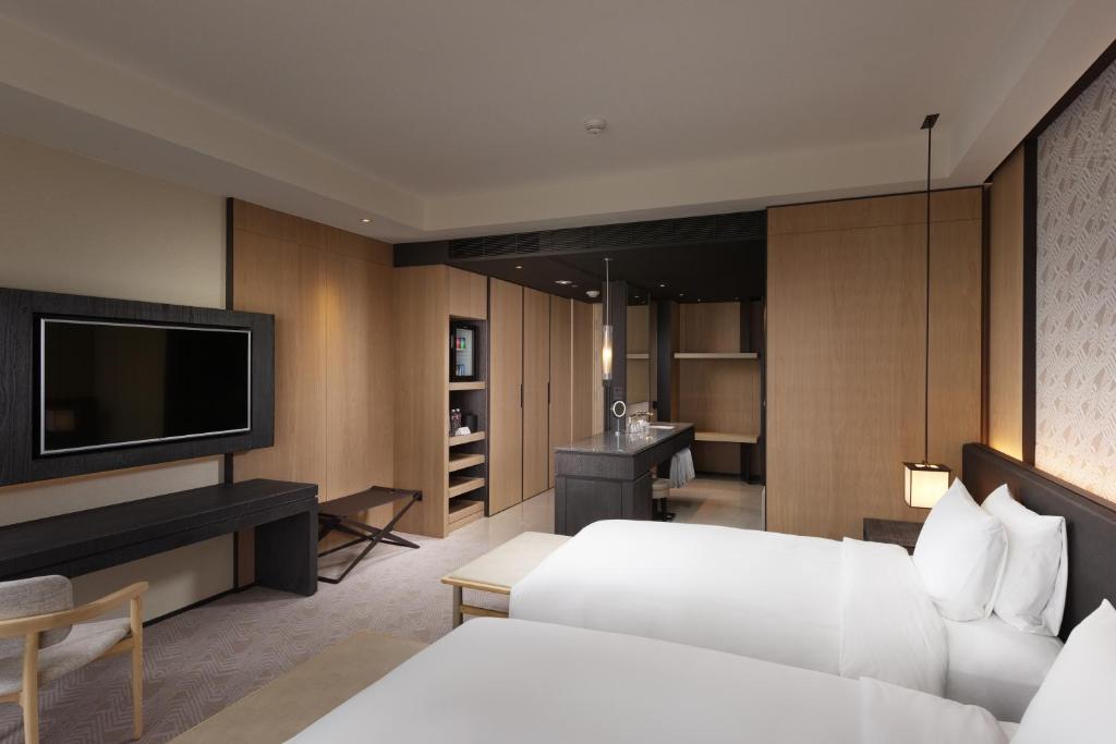 Postel nebo postele na pokoji v ubytování Crowne Plaza Tainan by IHG