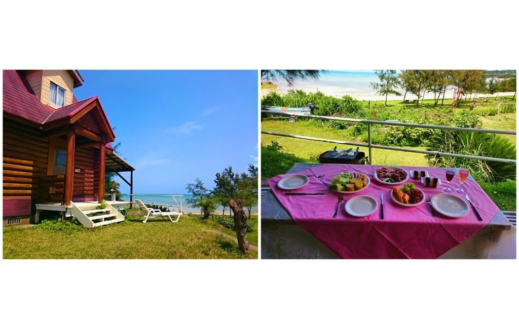 una mesa con comida junto a una casa en Garden Beach House, en Motobu