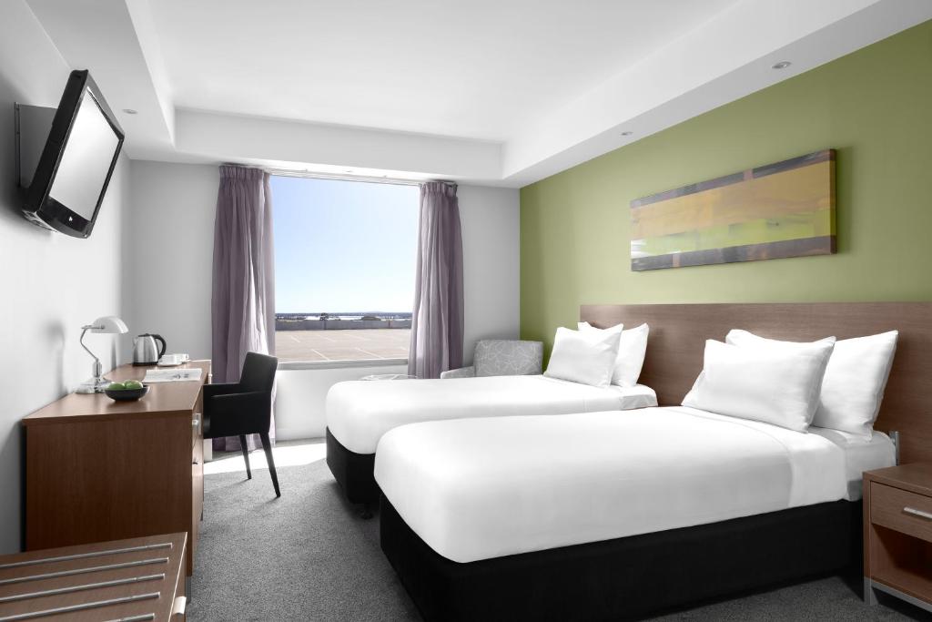 Postel nebo postele na pokoji v ubytování Mantra Melbourne Airport
