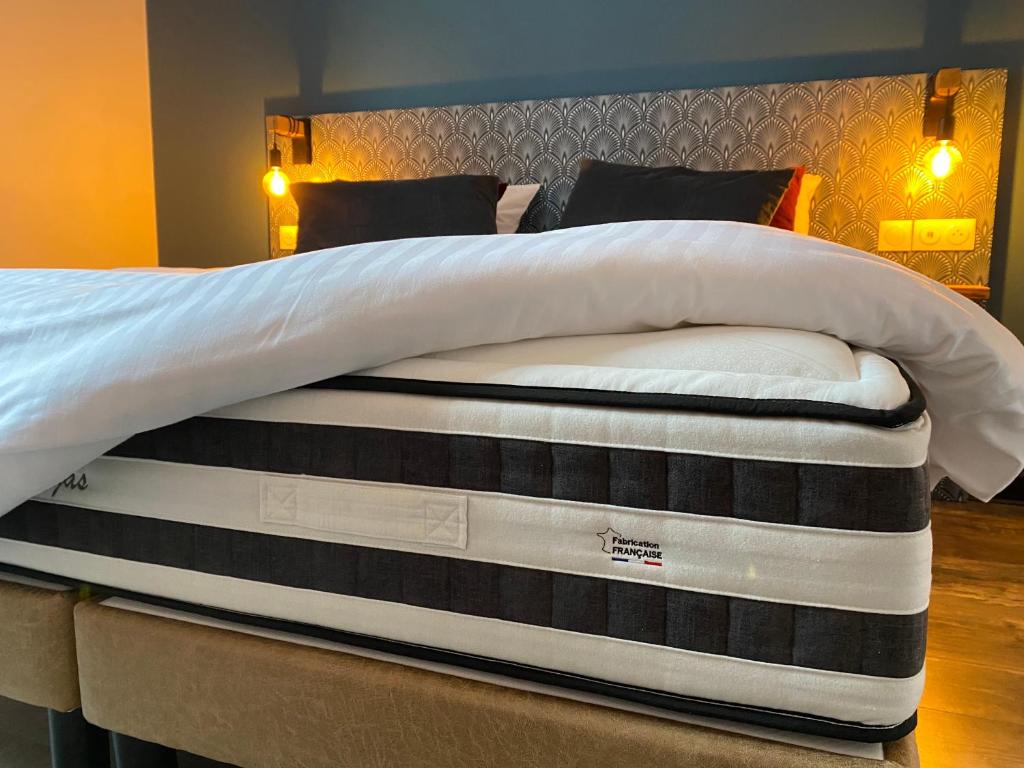 a mattress sitting on top of a bed at La Propriete de Bacchus in Saumur