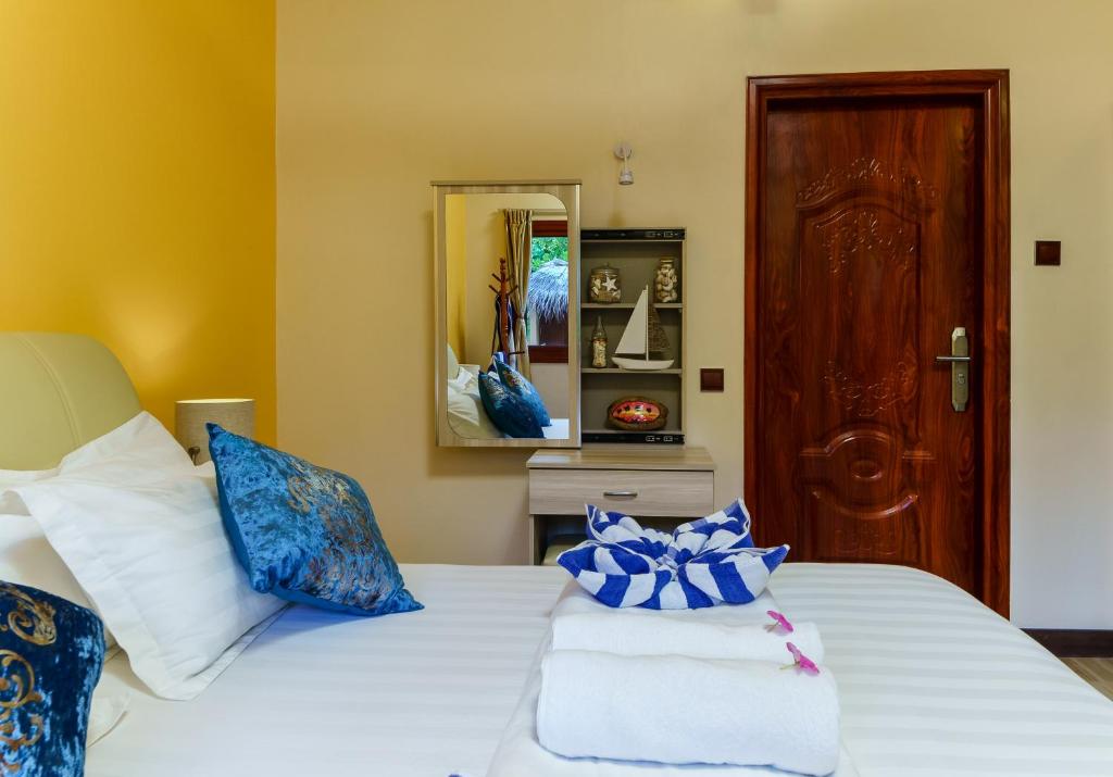 Postel nebo postele na pokoji v ubytování Sea View Villa Ukulhas