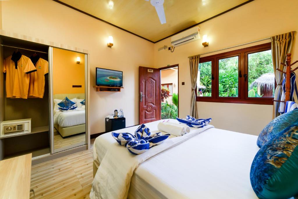 Postel nebo postele na pokoji v ubytování Sea View Villa Ukulhas