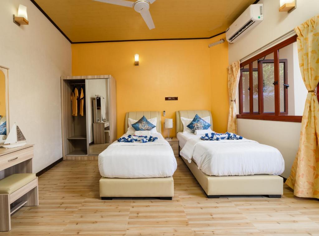 Postel nebo postele na pokoji v ubytování Sea View Villa Ukulhas