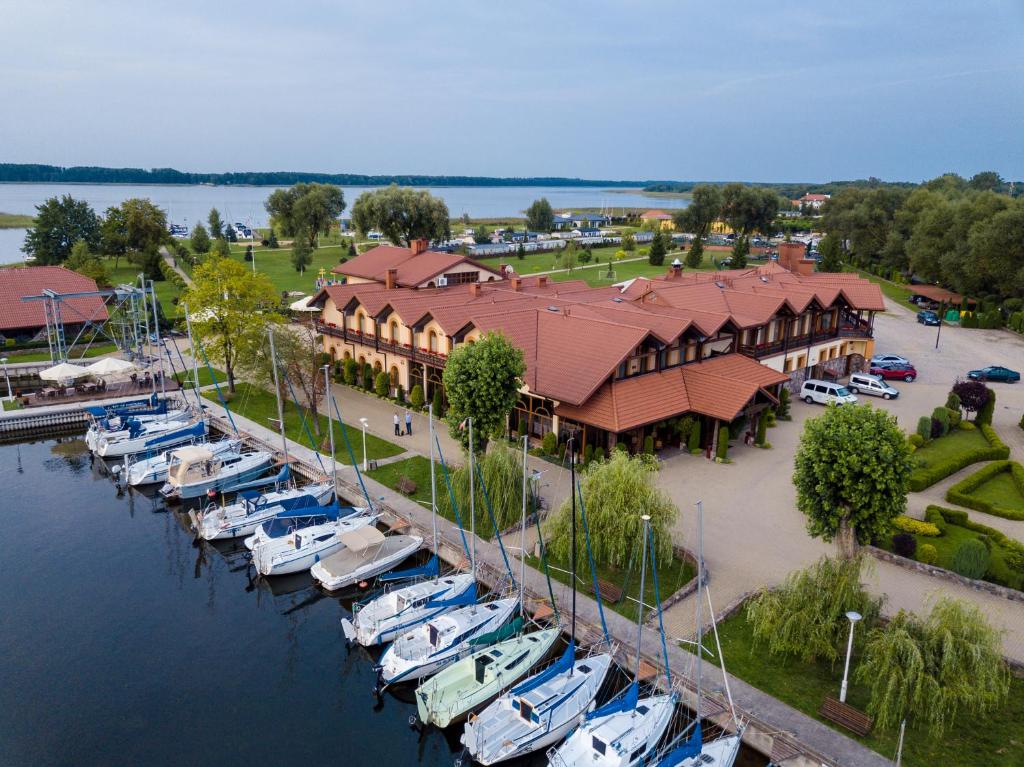 an aerial view of a marina with boats in the water at Hotel Roś in Pisz
