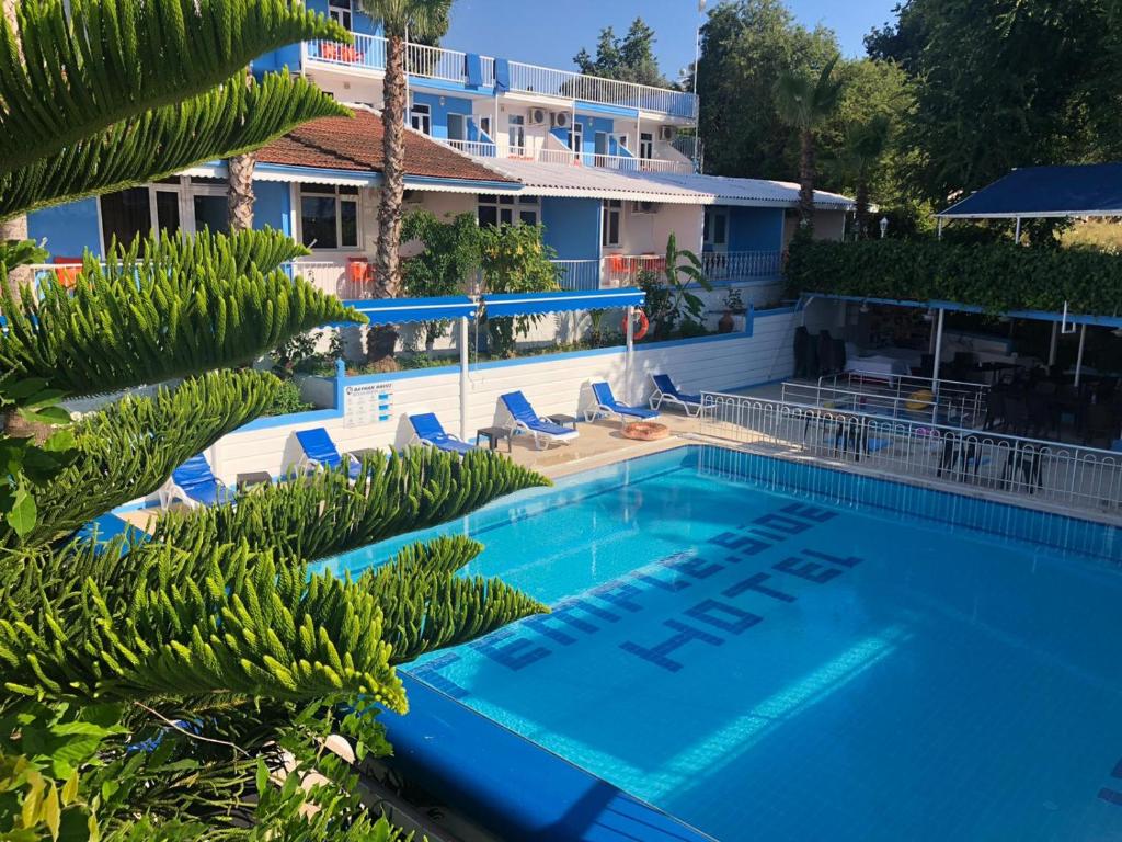 a swimming pool with a hotel in the background at Side Temple Hotel in Side
