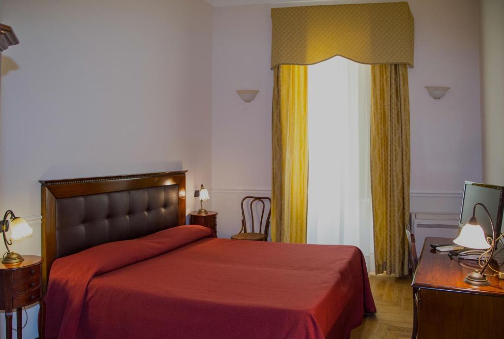 Postel nebo postele na pokoji v ubytování Residence Acropoli