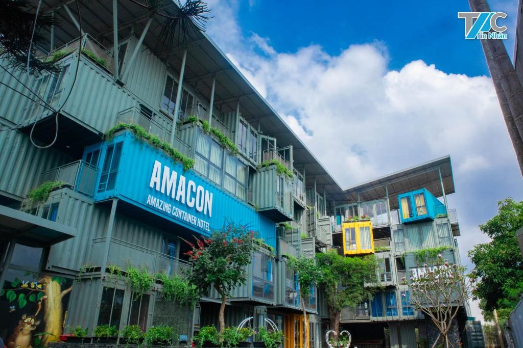 a building with an amazon sign on it at Amacon Hotel & Coffee in Buôn Kô Sir