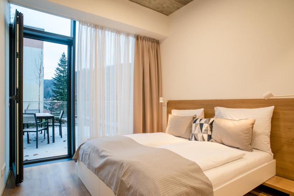 Letto o letti in una camera di ARMEX LiveCentrum