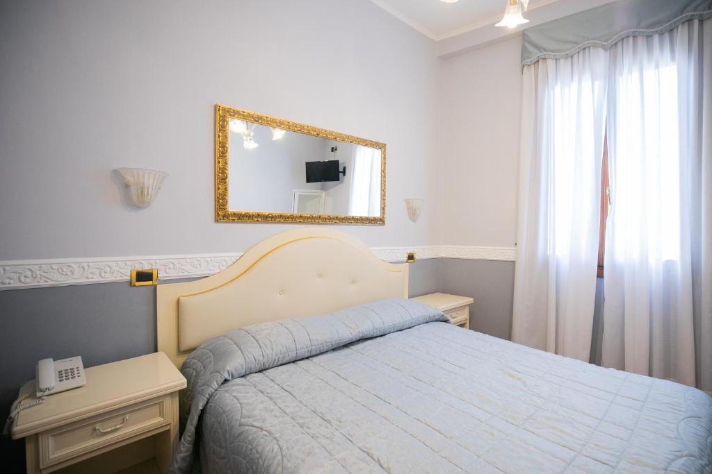 Postel nebo postele na pokoji v ubytování Hotel Riviera Venezia Lido