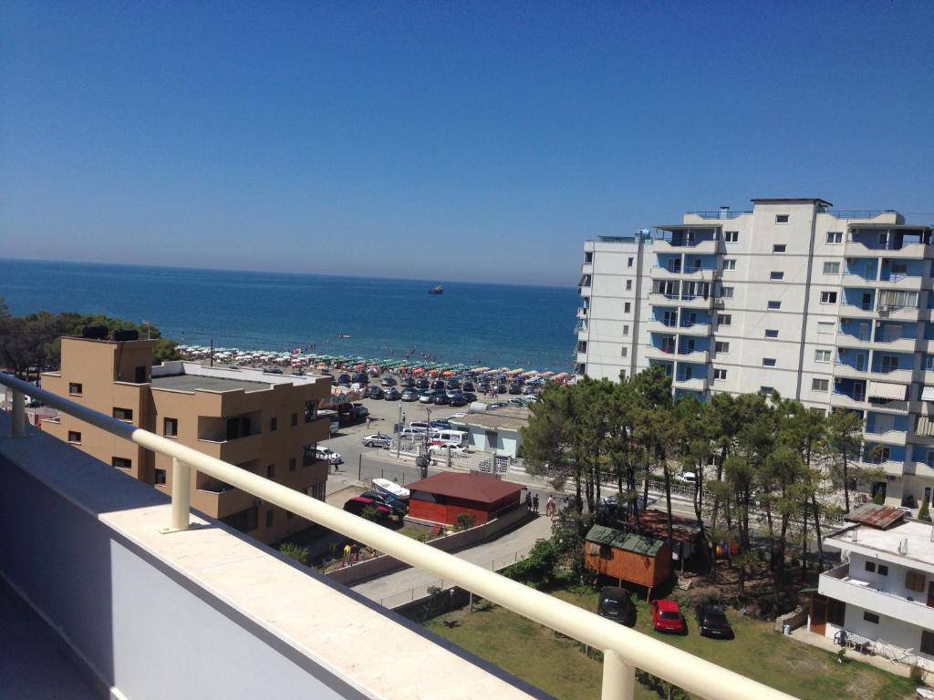 a view of the ocean from a balcony of a building at Nimfeum Apartments in Shëngjin