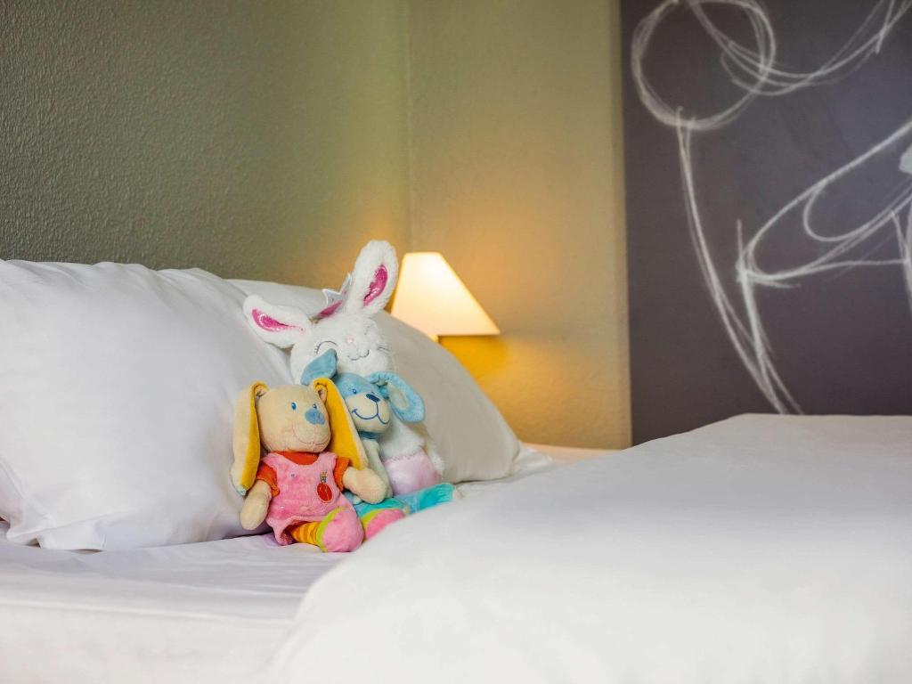 Postel nebo postele na pokoji v ubytování ibis Mulhouse Ile Napoleon
