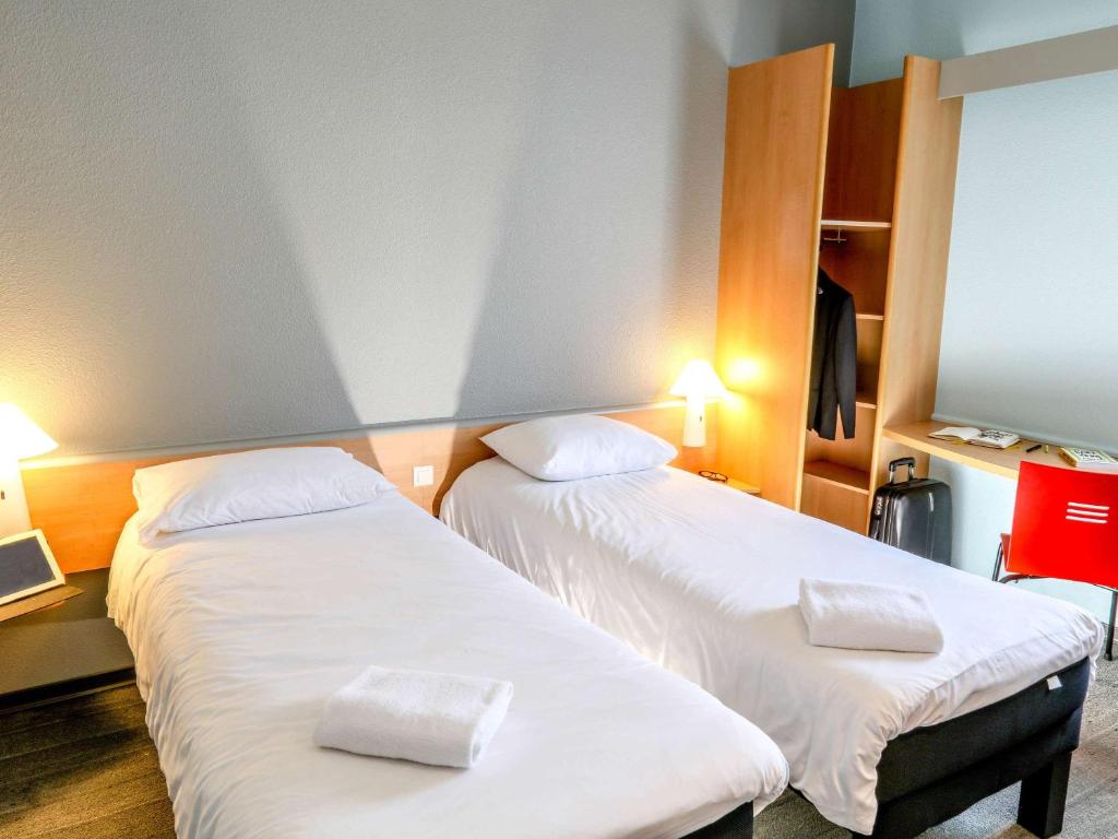 Postel nebo postele na pokoji v ubytování ibis Orange Sud