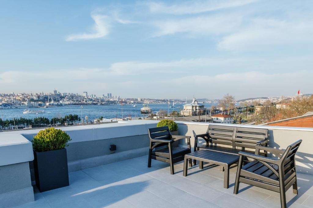 a balcony with chairs and a view of the water at Dream Bosphorus Hotel in Istanbul