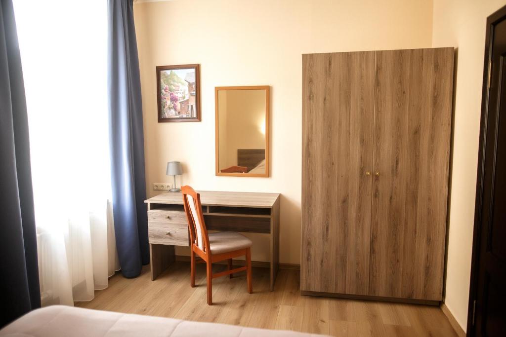 Postel nebo postele na pokoji v ubytování Oberig Hotel
