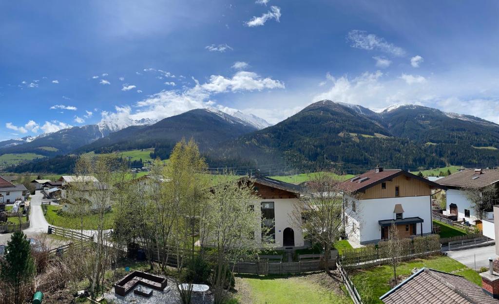 a view of a village with mountains in the background at Apartments Garden House in Niedernsill