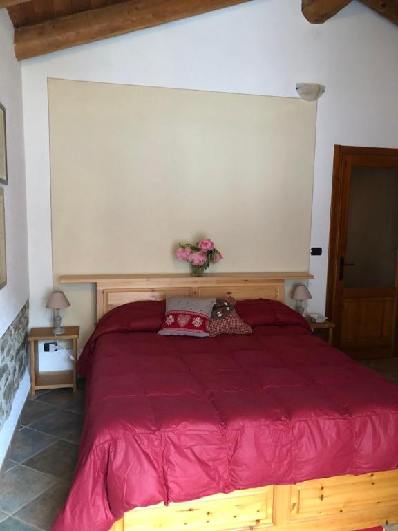 Postel nebo postele na pokoji v ubytování Agriturismo Ciambun