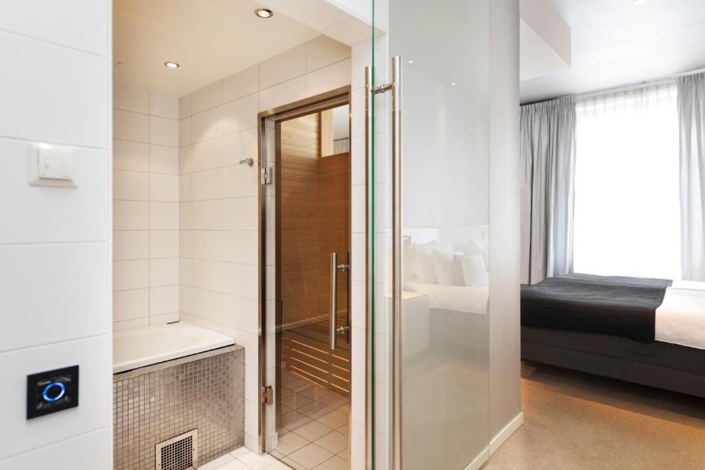 Postel nebo postele na pokoji v ubytování ProfilHotels Savoy