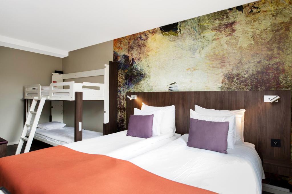 Postel nebo postele na pokoji v ubytování ProfilHotels Savoy